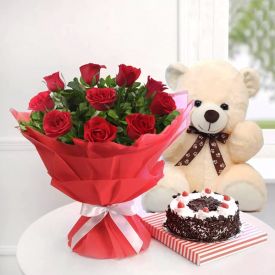Bunch of 10 red roses 1/2 kg black forest cake and small teddy-bear