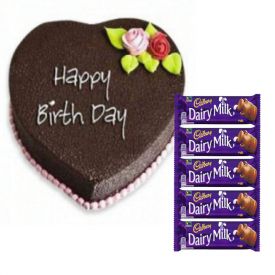 Heart shape cake with chocolates
