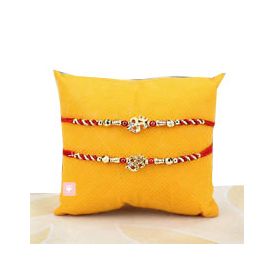 Rakhis with red and golden zari and 2 red stones