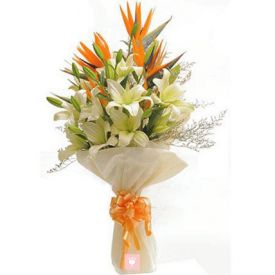 Bunch of white lilies with orange lilies