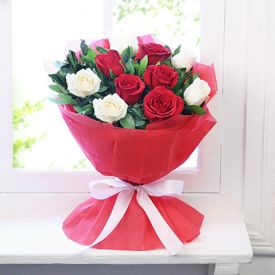 Bunch of red and white roses with paper packing