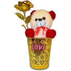 Golden roses in vase with soft toy